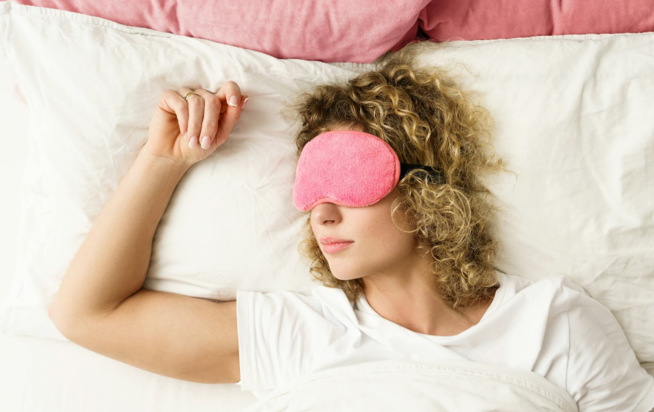beautiful woman sleeping with pink blindfold beautiful woman sleeping with pink blindfold